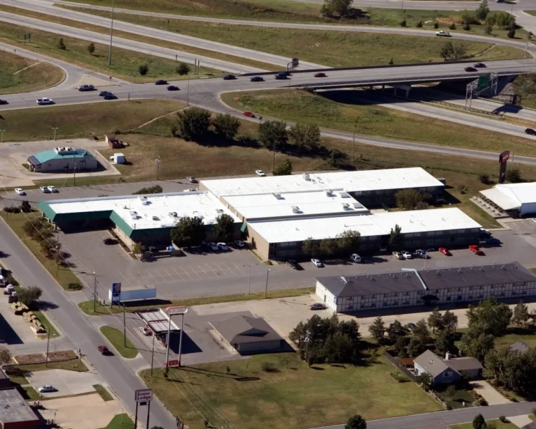 Aerial view of commercial buildings with white reflective roofs